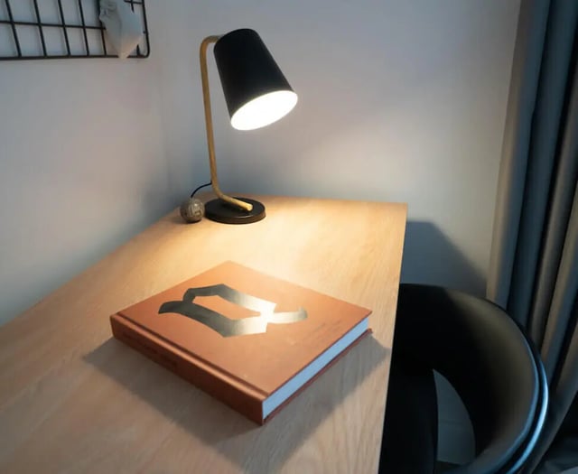 Desk with lamp book and chair study area at 5 Bedroom House at 38, Cavendish Street in Lancaster Student Accommodation
