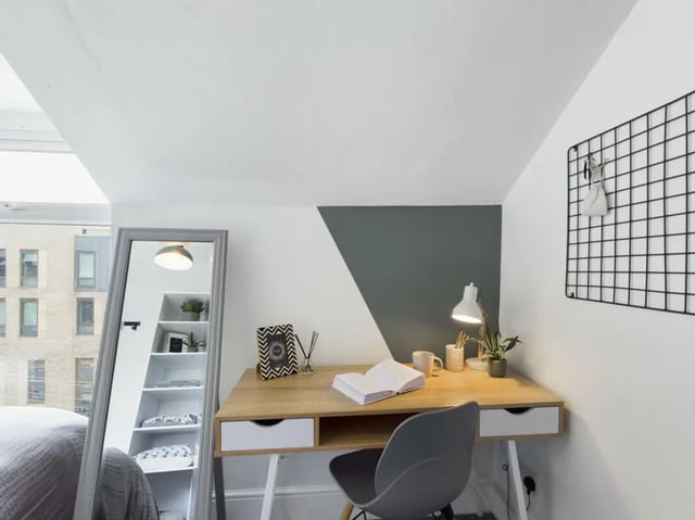 Desk with lamp mirror and shelves study area at 5 Bedroom House at 17, Gladstone Terrace in Lancaster Student Accommodation
