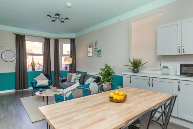 Sofa armchair dining table kitchen living kitchen at 5 Bedroom House at 64, Monson Street in Lincoln Student Accommodation