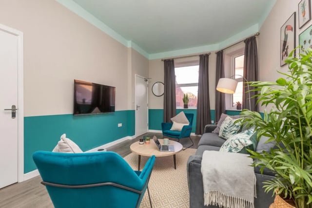 Sofa armchair coffee table TV living room at 5 Bedroom House at 64, Monson Street in Lincoln Student Accommodation