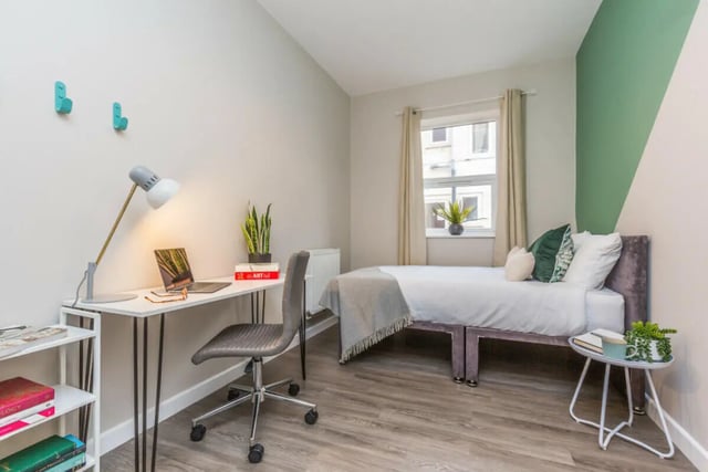 Desk laptop plant bed and nightstand bedroom at 5 Bedroom House at 64, Monson Street in Lincoln Student Accommodation