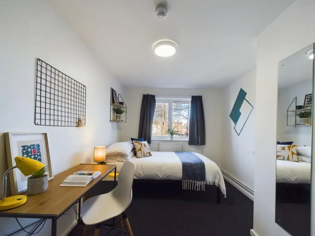 Bed desk chair lamp framed art and mirror bedroom at 6 Bedroom House at 1, Brookside in Derby Student Accommodation