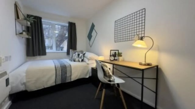 Bed desk chair lamp shelf bedroom at 4 Bedroom House at 17, Brookside in Derby Student Accommodation