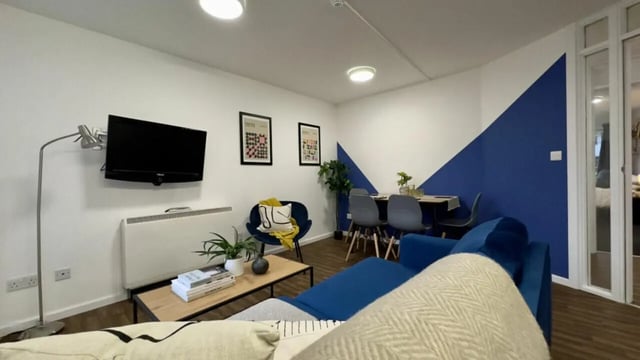 Sofa TV dining table living room at 4 Bedroom House at 17, Brookside in Derby Student Accommodation