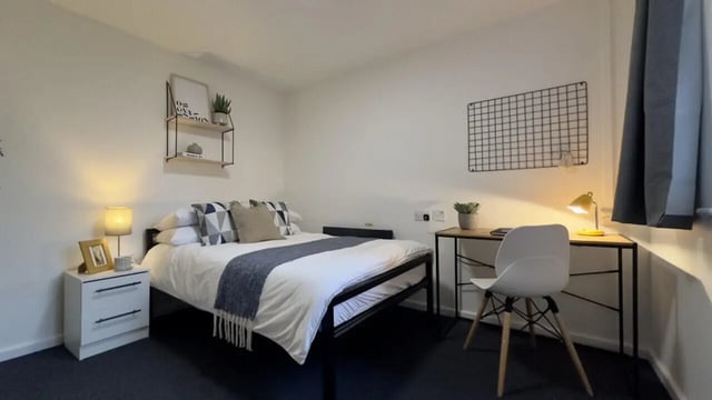 Bed desk chair bedside table bedroom at 3 Bedroom House at 20, Brookside in Derby Student Accommodation