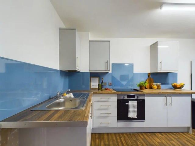 Modern kitchen with cabinets sink and oven kitchen at 3 Bedroom House at 20, Brookside in Derby Student Accommodation