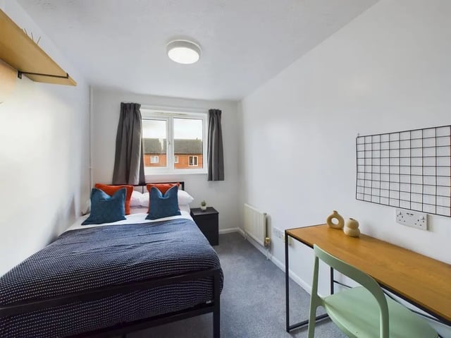Bed desk chair window black bedside table bedroom at 6 Bedroom House at 1, Mint Road in Leicester Student Accommodation
