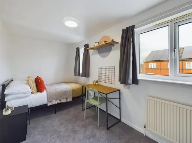 Bed desk chair and radiator bedroom at 6 Bedroom House at 1, Mint Road in Leicester Student Accommodation