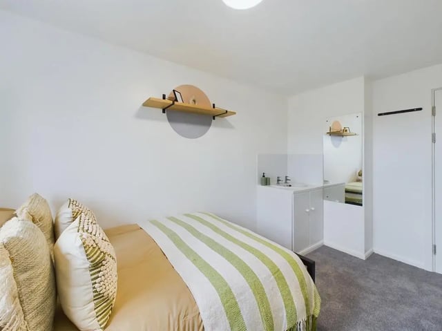 Bed with pillows and sink unit Bedroom at 6 Bedroom House at 1, Mint Road in Leicester Student Accommodation