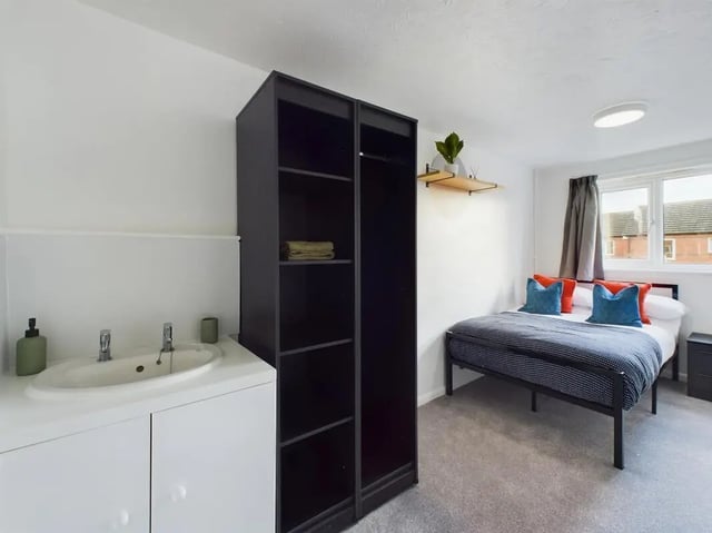 Sink wardrobe bed with pillows bedroom at 6 Bedroom House at 3, Mint Road in Leicester Student Accommodation