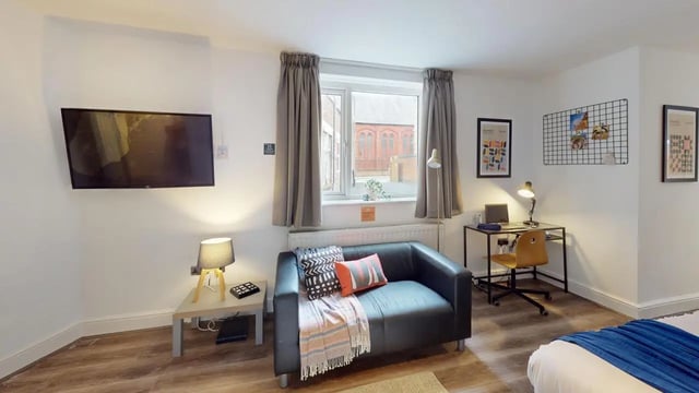 Sofa desk television and bed living room at 1 Bedroom House at Flat 3, 265, Edge Lane in Liverpool Student Accommodation