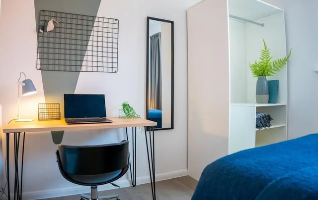 Desk laptop chair mirror and closet bedroom at 5 Bedroom House at 64C, Monson Street in Lincoln Student Accommodation