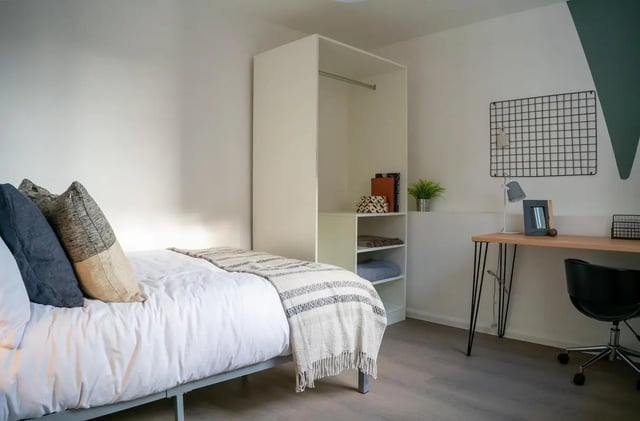 Bed desk wardrobe and pillows bedroom at 5 Bedroom House at 64C, Monson Street in Lincoln Student Accommodation