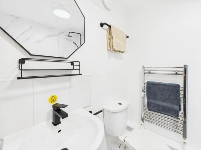 White sink faucet shelf mirror and toilet Bathroom at 2 Bedroom House at Flat 1, Grove Street Studios, The Groves in Liverpool Student Accommodation