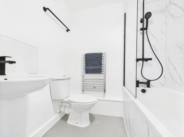 Sink toilet towel rail and bath with shower bathroom at 1 Bedroom House at Flat 3, Grove Street Studios, The Groves in Liverpool Student Accommodation