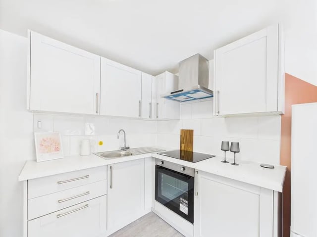 White cabinets sink oven and hob kitchen at 2 Bedroom House at Flat 17, Grove Street Studios, The Groves in Liverpool Student Accommodation