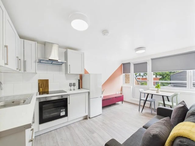 Kitchen with sofa and dining table interior at 2 Bedroom House at Flat 17, Grove Street Studios, The Groves in Liverpool Student Accommodation