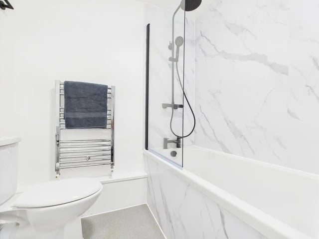 Toilet towel rack shower and bathtub bathroom at 1 Bedroom House at Flat 20, Grove Street Studios, The Groves in Liverpool Student Accommodation