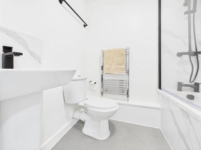 Sink toilet towel rail shower bathtub bathroom at 1 Bedroom House at Flat 22, Grove Street Studios, The Groves in Liverpool Student Accommodation