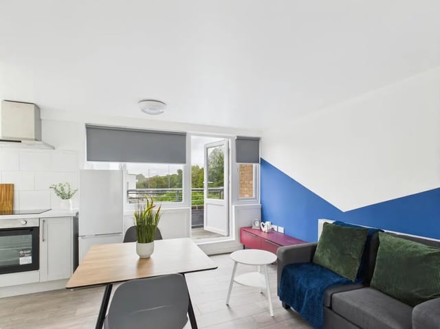 Kitchen table couch and balcony living area at 1 Bedroom House at Flat 25, Grove Street Studios, The Groves in Liverpool Student Accommodation