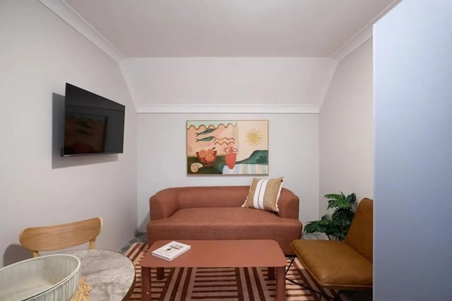 Sofa artwork TV chair living room at UKO Redfern in Sydney Student Accommodation