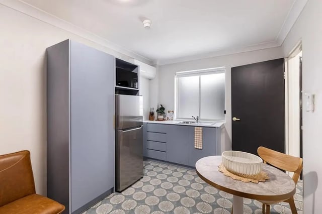 Kitchenette with microwave fridge and table kitchen at UKO Redfern in Sydney Student Accommodation
