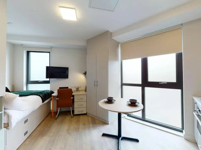 Bed desk chair TV table and bowls Bedroom at SEREN in Swansea Student Accommodation