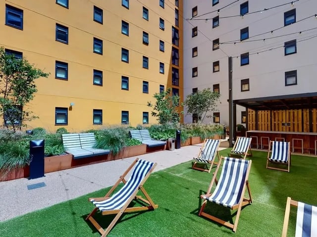 Outdoor seating and bar area exterior at SEREN in Swansea Student Accommodation