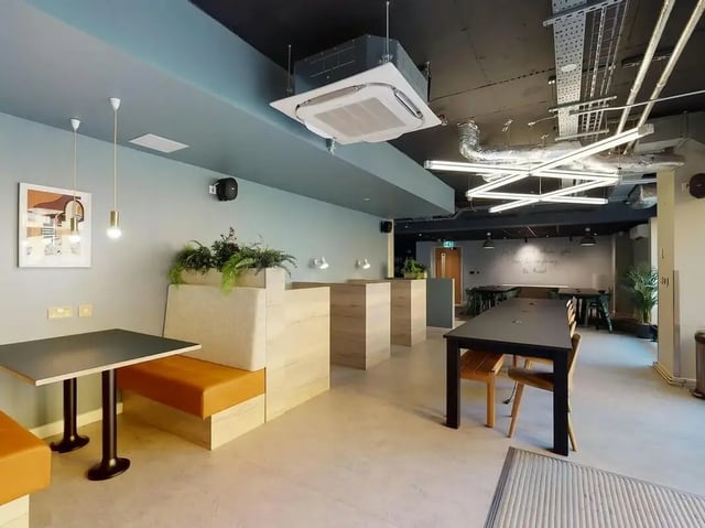 Banquette seating tables and chairs communal area at SEREN in Swansea Student Accommodation