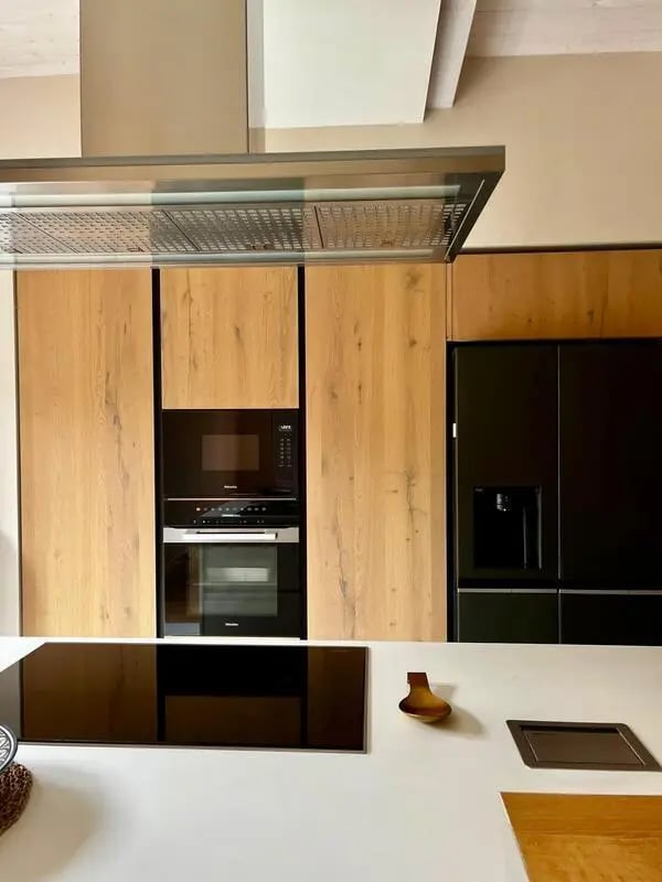 Modern kitchen with wooden cabinets oven and fridge kitchen at Welcoming double ensuite bedroom near the Vezzano Ligure train station in La Spezia Student Accommodation