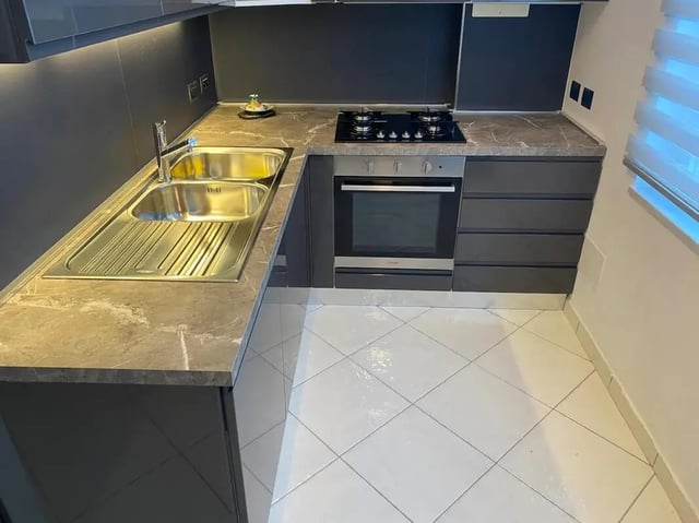 Sink oven stovetop cabinets kitchen at Appartamento di due stanze in Sant'Agnello Student Accommodation