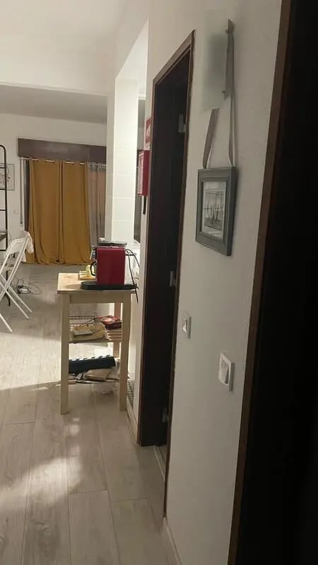 Small table red appliance picture frame hallway at 1-bedroom flat in Armação de Pêra with balcony all electric no Gas in Silves Student Accommodation