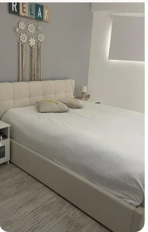 Large bed with pillows on it bedroom at 1-bedroom flat in Armação de Pêra with balcony all electric no Gas in Silves Student Accommodation
