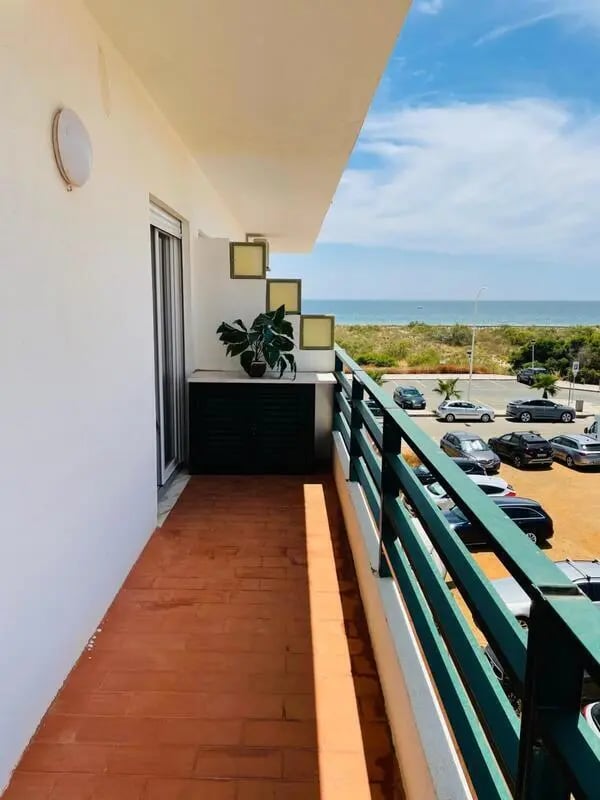 Balcony with plants and sea view exterior at Sunny flat very close to the beach in Faro Student Accommodation