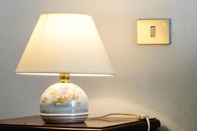 Floral lamp and light switch bedroom detail at Cosy double-bedroom apartment in Albenga (SV) in Albenga Student Accommodation