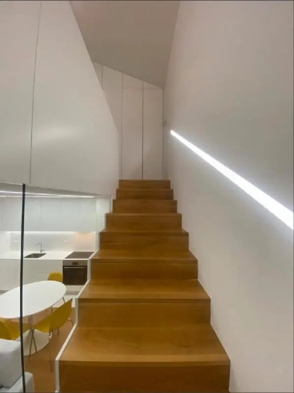 Wooden stairs and modern kitchen area with table Living room at Luxury 1 Bedroom Apartment close to  Polytechnic Institute of Viana do Castelo in Viana Do Castelo Student Accommodation