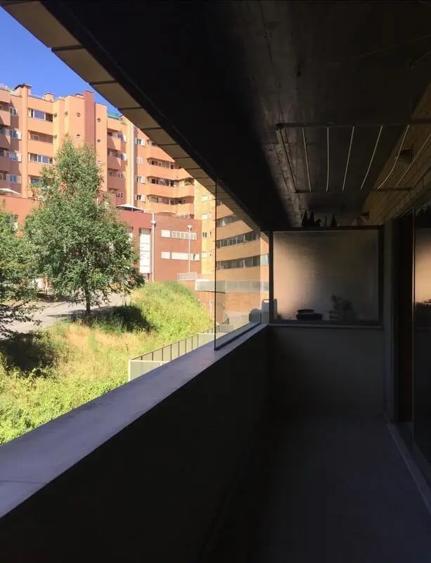 Balcony overlooking green hill and apartment buildings balcony at Exclusive 2 Bedroom Apartment with a balcony close to Minho University in Guimaraes Student Accommodation