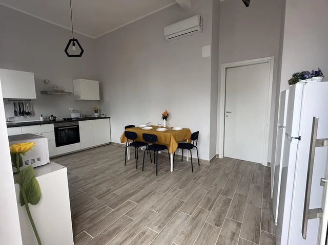Kitchen with dining table and refrigerator kitchen at Amazing single room in Pescara in Pescara Student Accommodation