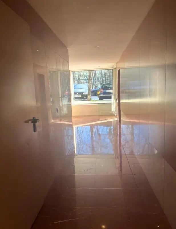 Hallway with cars visible through window exterior at Exclusive 2 Bedroom Apartment with a balcony close to Minho University in Guimaraes Student Accommodation