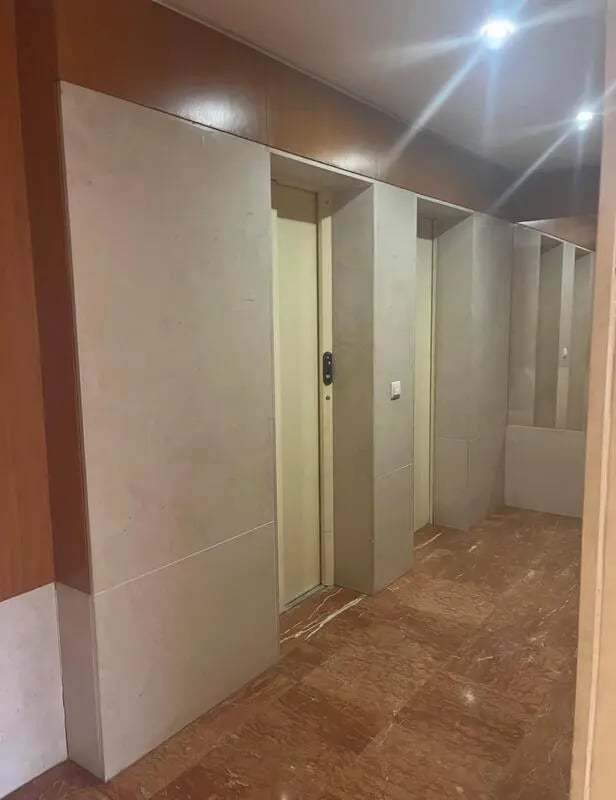Elevator doors and marble floor hallway interior at Exclusive 2 Bedroom Apartment with a balcony close to Minho University in Guimaraes Student Accommodation