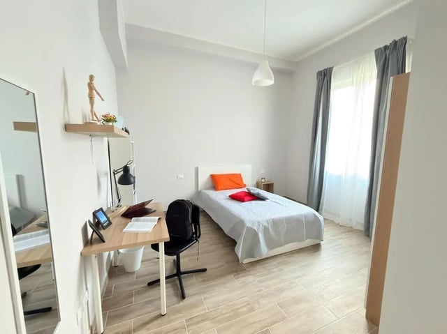 Desk bed chair mirror shelves bedroom at Amazing single room in Pescara in Pescara Student Accommodation