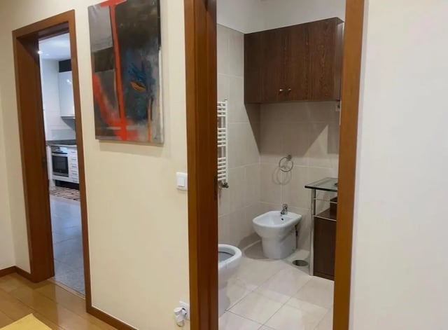 Toilet bidet towel rack and cabinets bathroom at Exclusive 2 Bedroom Apartment with a balcony close to Minho University in Guimaraes Student Accommodation