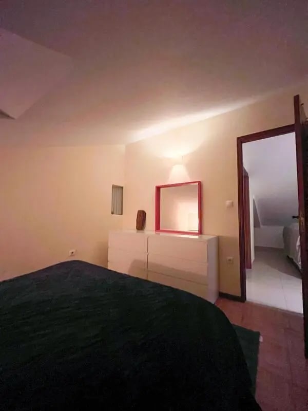 Bed dresser mirror doorway bedroom at Beachfront Loft in Viana Do Castelo Student Accommodation