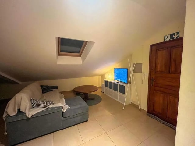 Sofa television and table living room at Beachfront Loft in Viana Do Castelo Student Accommodation