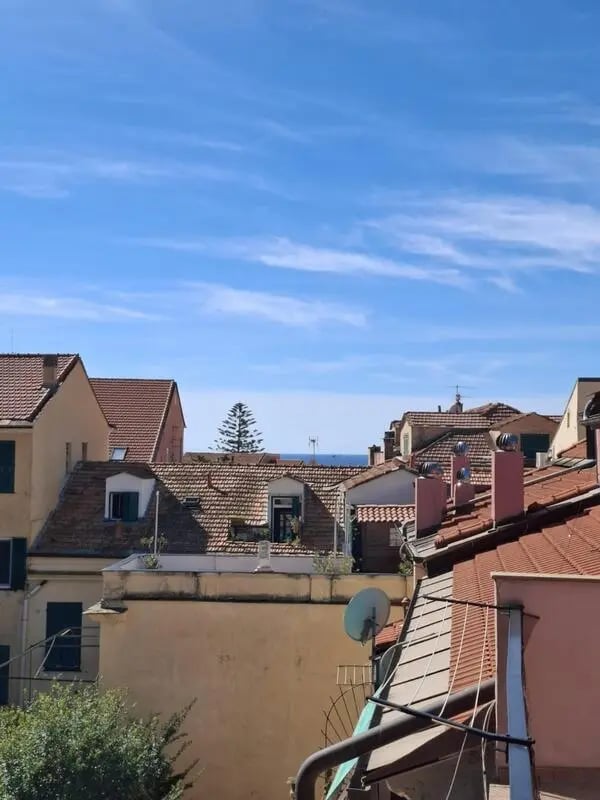 Rooftops and balconies against blue sky exterior at Apartment with Terrace in Imperia in Imperia Student Accommodation