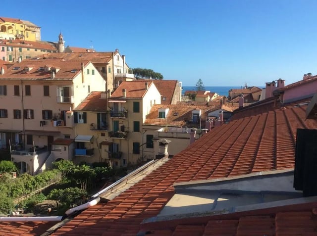 Terracotta tiled roofs with buildings exterior at Apartment with Terrace in Imperia in Imperia Student Accommodation