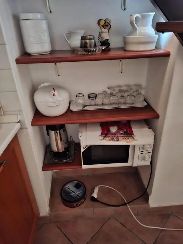 Kitchenware microwave and kettle kitchen at Apartment with Terrace in Imperia in Imperia Student Accommodation