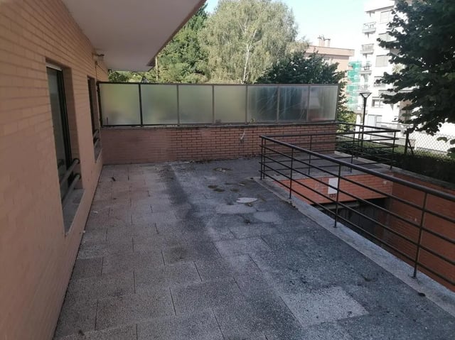 Brick building with frosted glass balcony exterior at Cozy Single Bedroom close to Lavandeira Park in Vila Nova De Gaia Student Accommodation