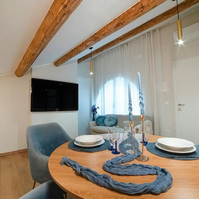 Dining table with chairs and sofa living room at Inviting 1-bedroom apartment near Pescara Centrale in Pescara Student Accommodation