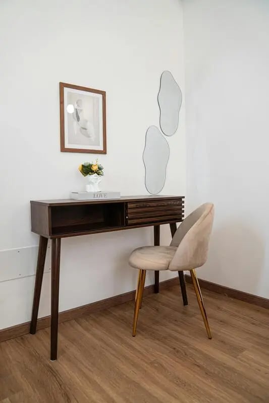 Desk chair framed art and mirrors study area at 1-Bedroom apartment near the Pescara Centrale in Pescara Student Accommodation
